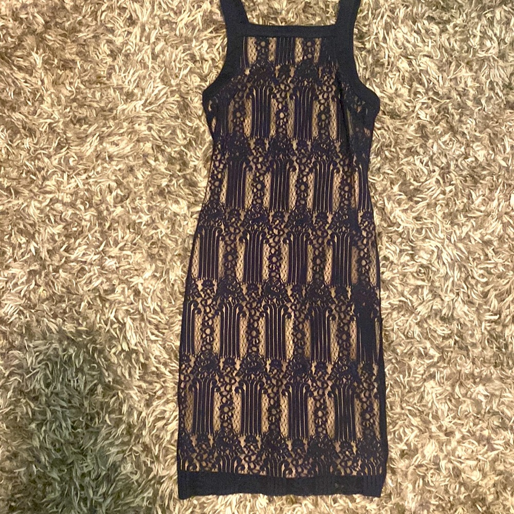 Small navy blue dress hits just below knee